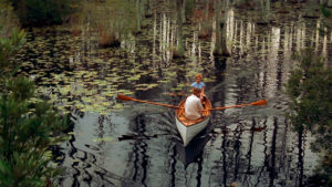 A photo of a couple in a kayak on a creek from the movie The Notebook